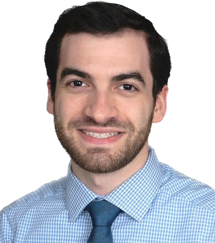 Dr Jonathan Lewis smiling in a blue shirt